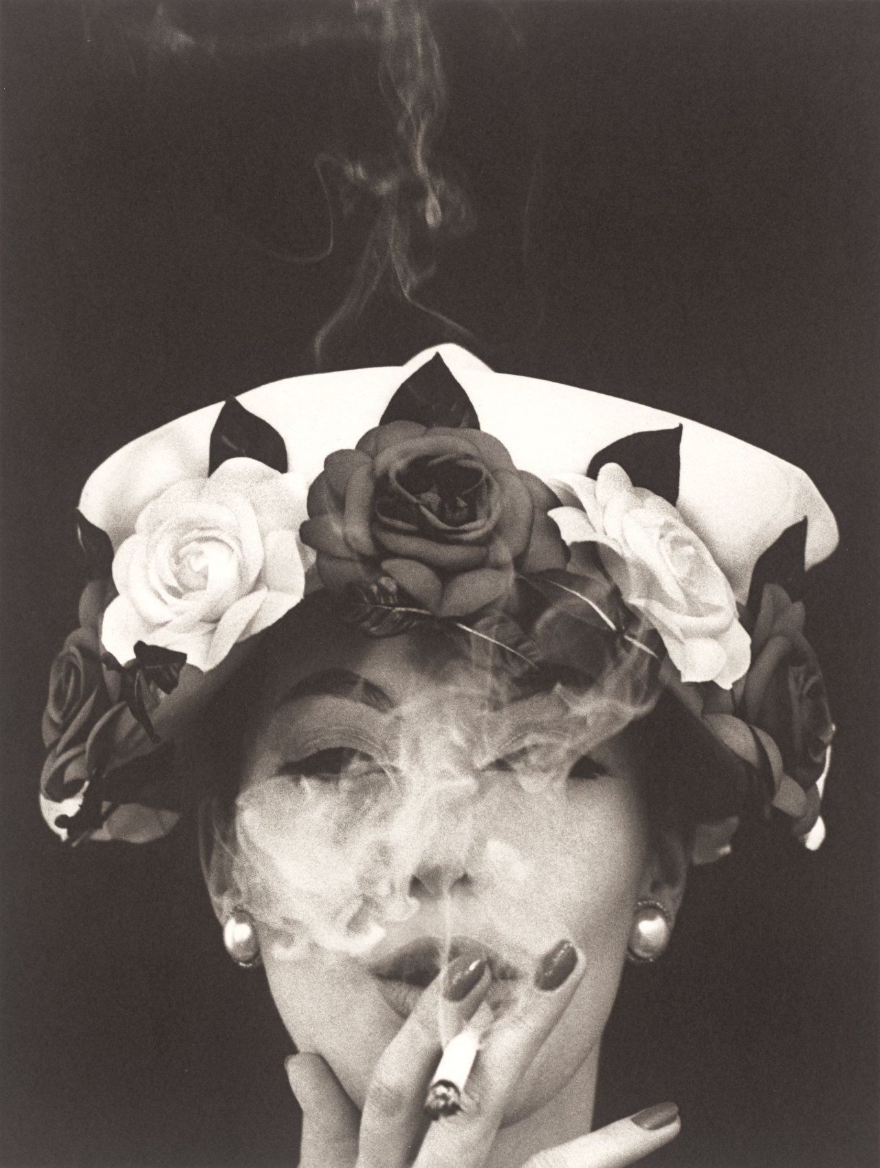 This picture shows the following artwork: William Klein. Hat + 5 Roses, Paris (Vogue). 1956.