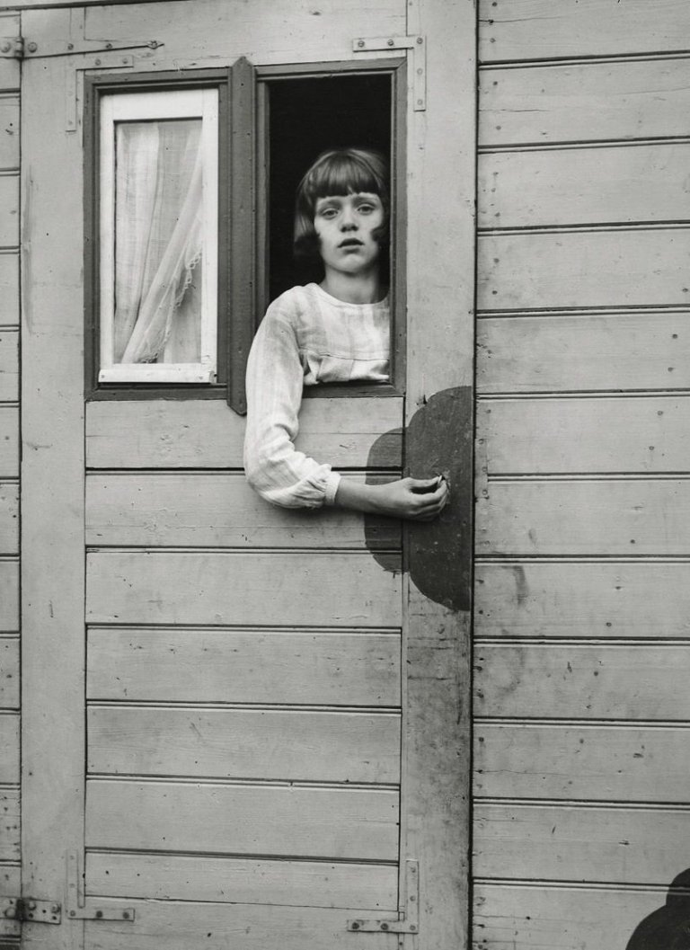 This picture shows the following artwork: August Sander. Girl in a circus caravan, Cologne. 1926.