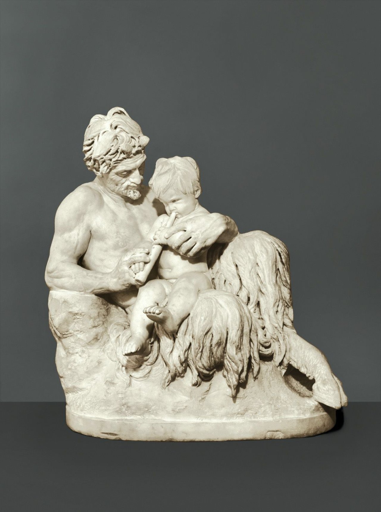 Auf diesem Bild ist das folgende Kunstwerk zu sehen: Reinhold Begas. „Pan als Lehrer des Flötenspiels“. 1858/68.