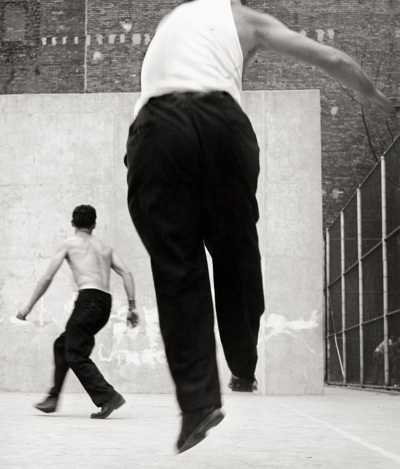This picture shows the following artwork: Leon Levinstein. Handball Players, Houston Street, New York. Circa 1969.