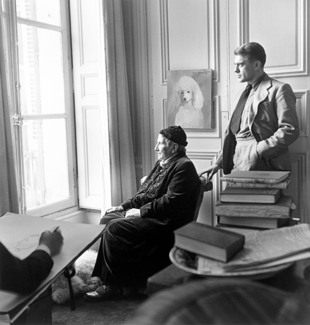 This picture shows the following artwork: Horst P. Horst (i.e. Horst Paul Albert Bohrmann). Carl Erickson drawing Gertrude Stein and Horst, Paris. 1946.