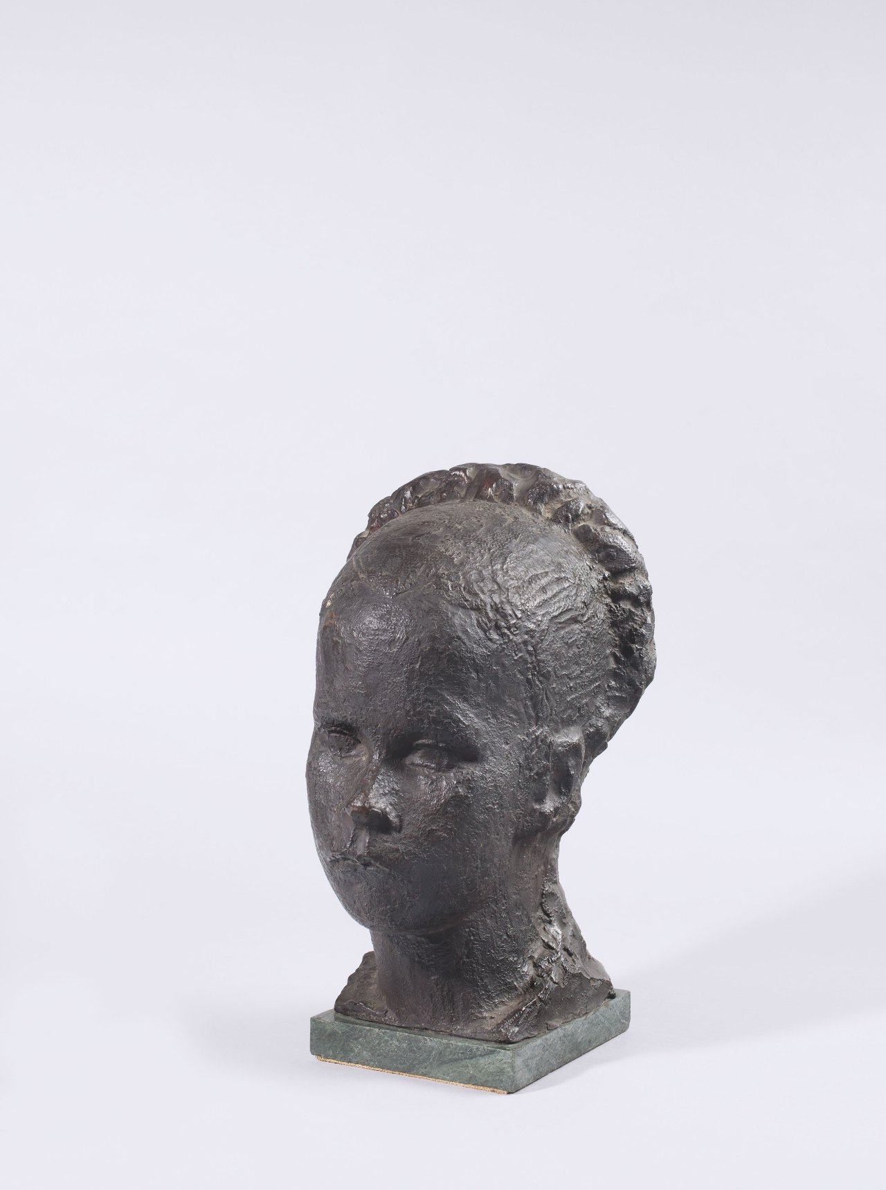 This picture shows the following artwork: Bernhard Hoetger. Female head with braided hair. 1936.