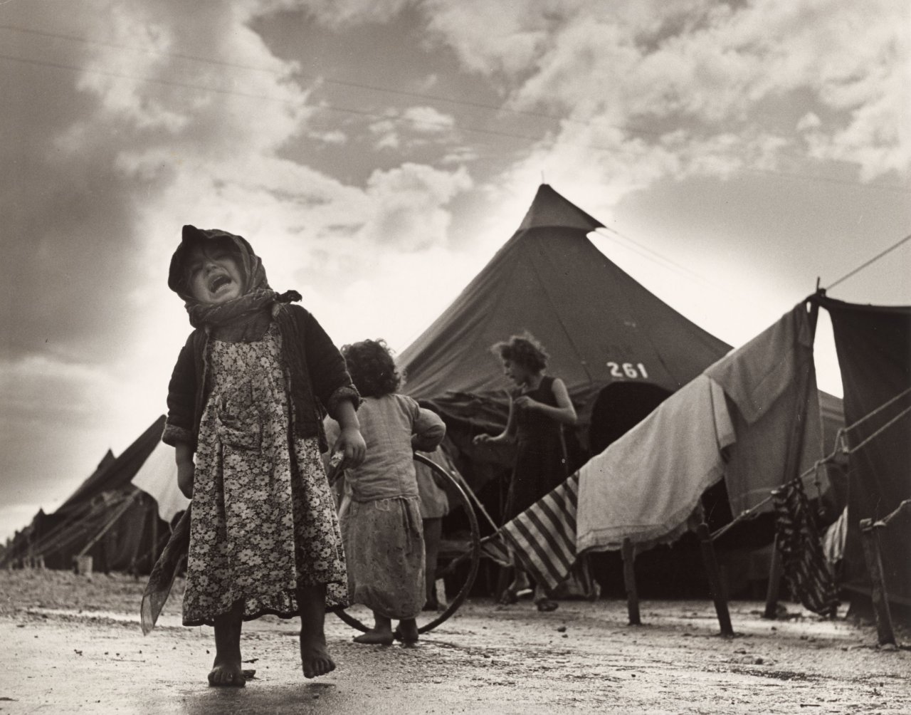 This picture shows the following artwork: Robert Capa (i.e. Endre Ernő Friedmann). Child at the Sha'ar Ha'aliya transit camp for new immigrants. Near Haifa, Israel. 1950.