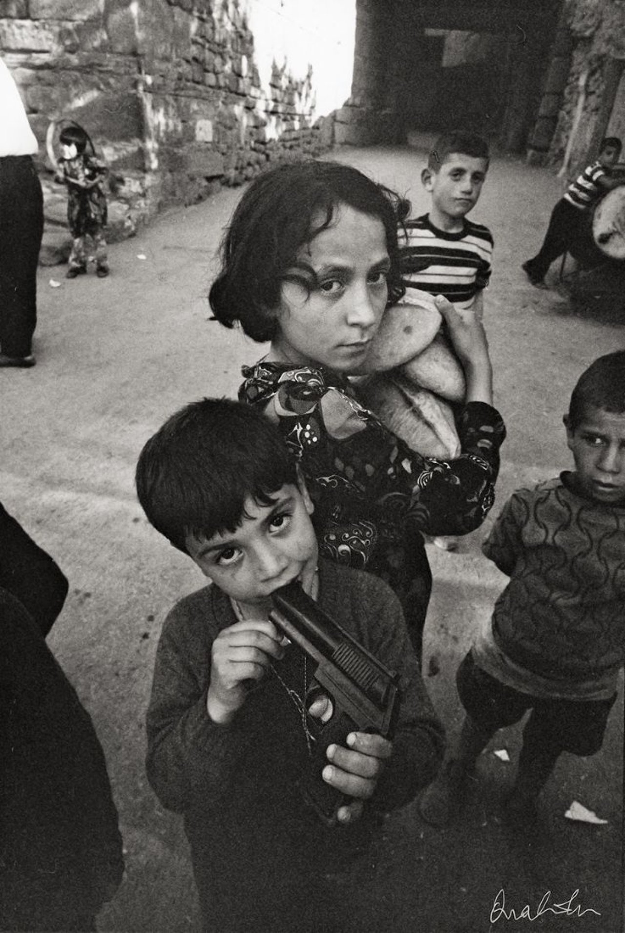 This picture shows the following artwork: Ara Güler. Playing children in Ankara Kaleici. 1970.