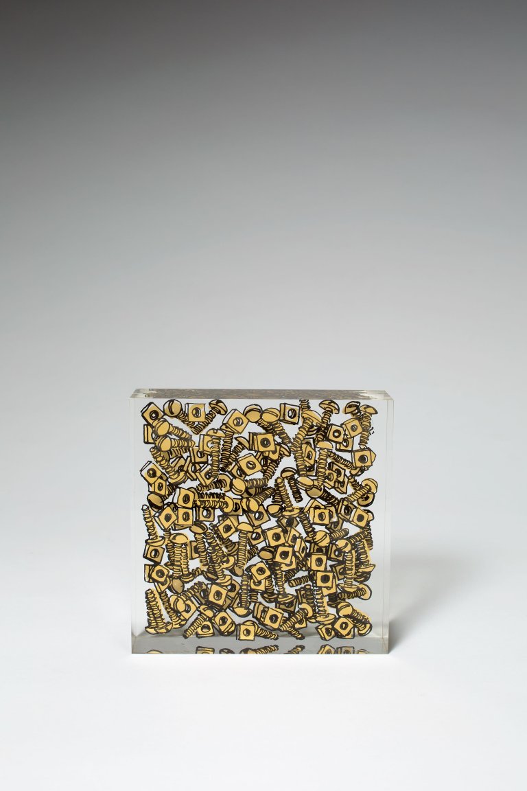 Auf diesem Bild ist das folgende Kunstwerk zu sehen:  Arman. Schrauben. Um 1981.