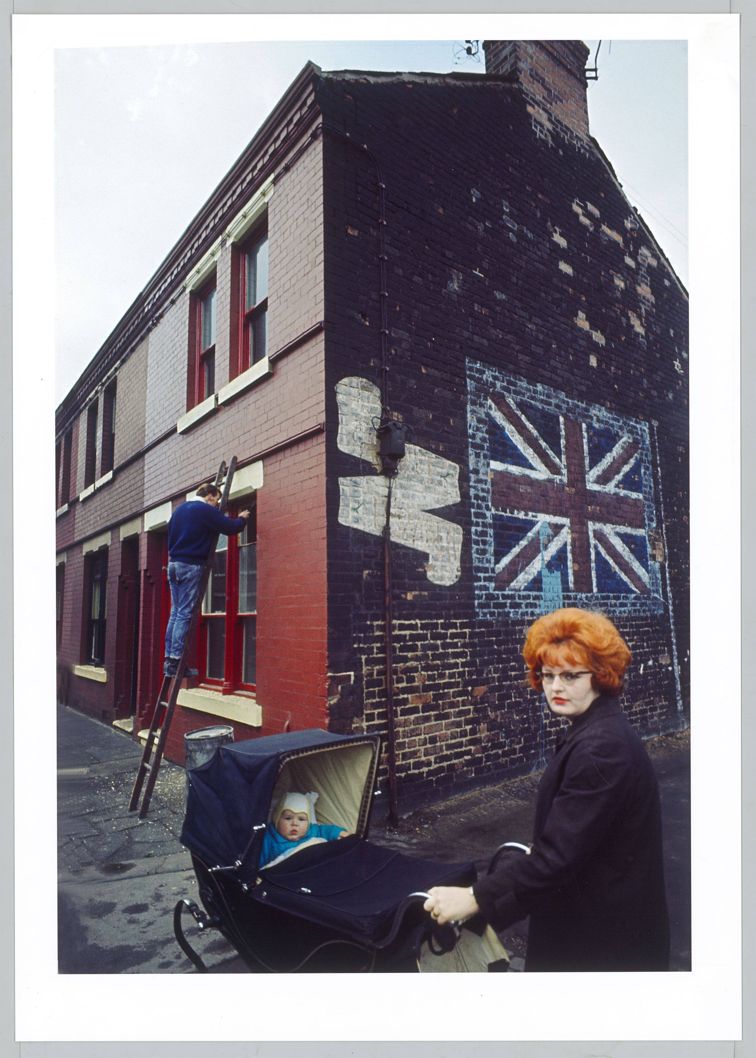 This picture shows the following artwork: John Bulmer. Redhead with Pram, Liverpool, from the series ”The North”. 1965.