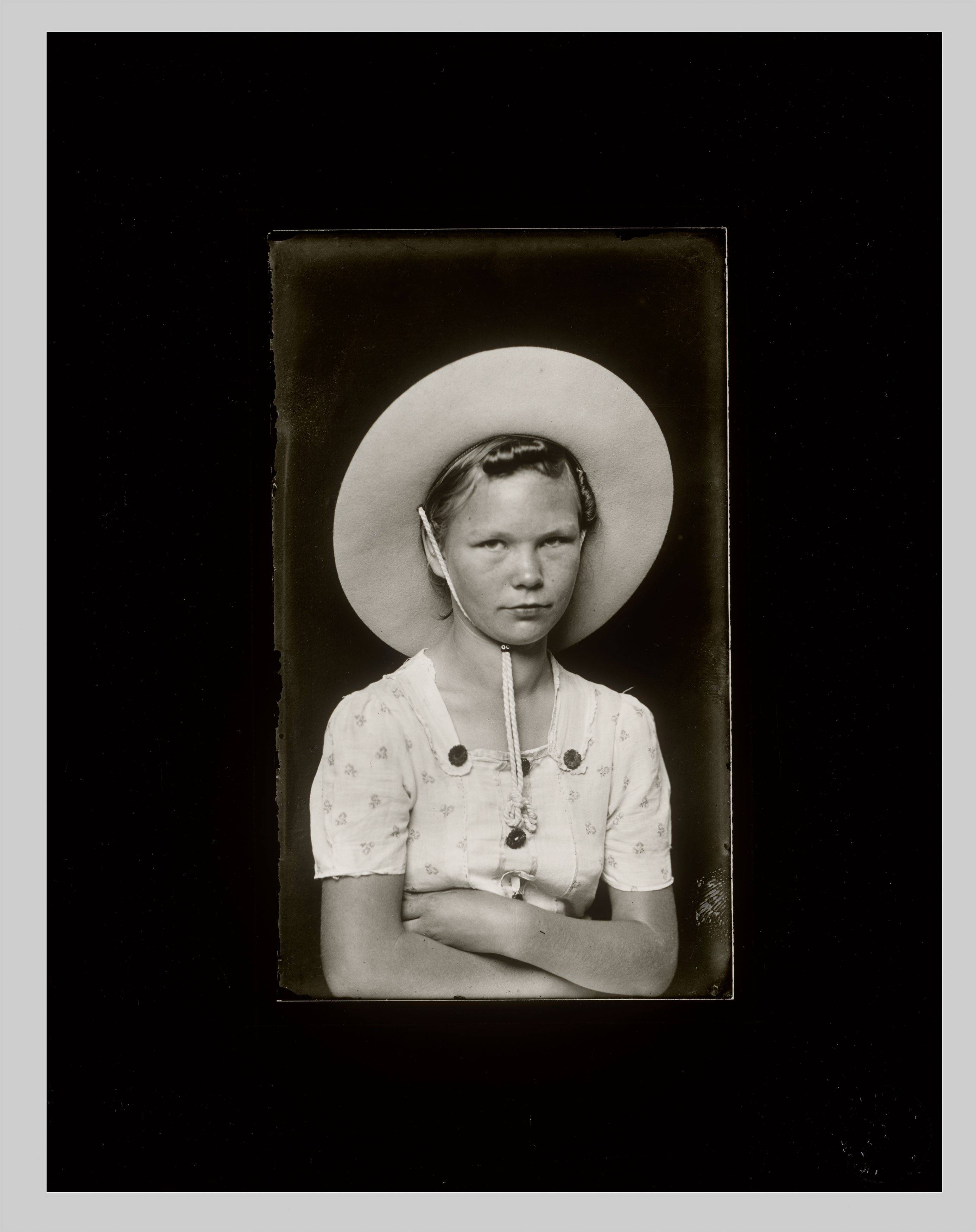 This picture shows the following artwork: Mike Disfarmer. Girl with Large Hat. 1939/1946.