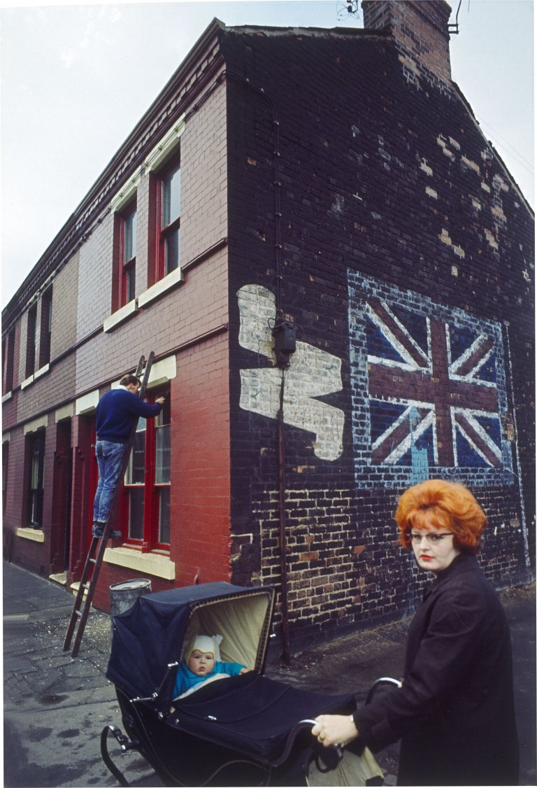 This picture shows the following artwork: John Bulmer. Redhead with Pram, Liverpool, from the series ”The North”. 1965.