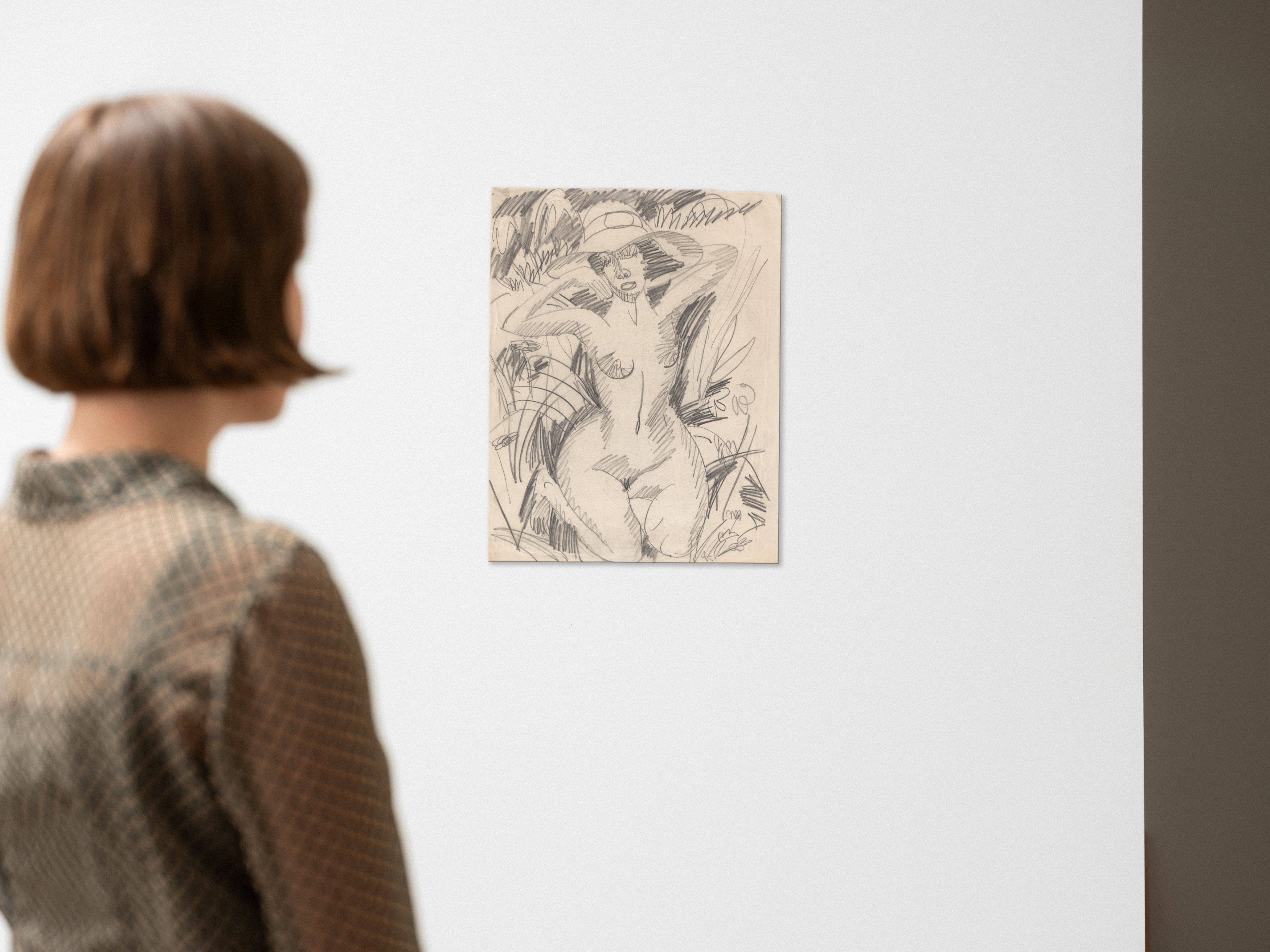 This picture shows the following artwork: Ernst Ludwig Kirchner. Kneeling female nude with hat in dunes. 1912.