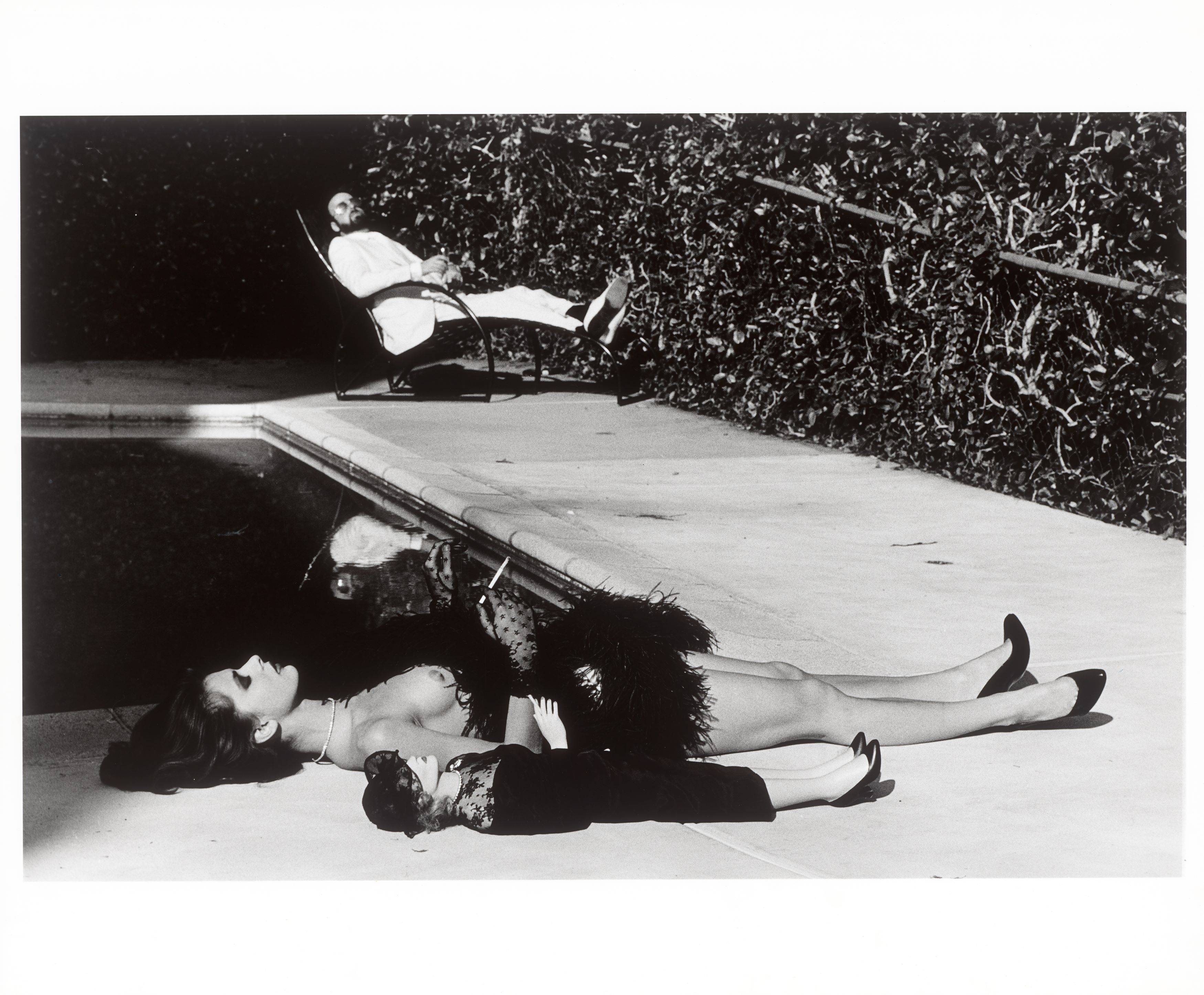 This picture shows the following artwork: Helmut Newton. ”Nastassia Kinski with Marlene Dietrich doll and the director James Toback, Hollywood”. 1983.