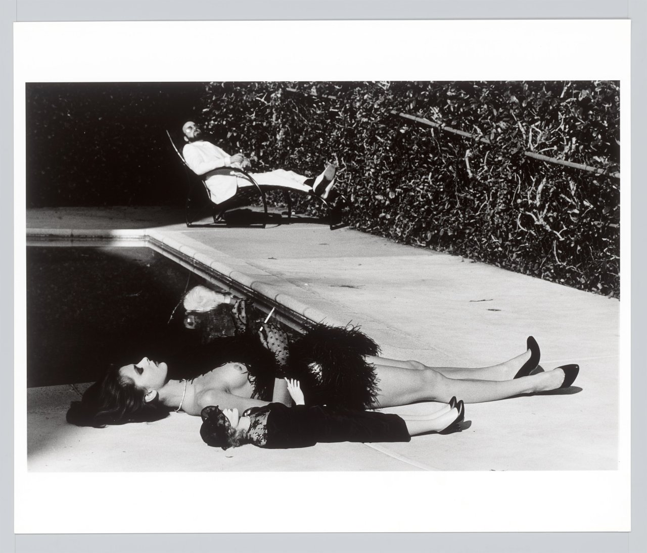 This picture shows the following artwork: Helmut Newton. ”Nastassia Kinski with Marlene Dietrich doll and the director James Toback, Hollywood”. 1983.